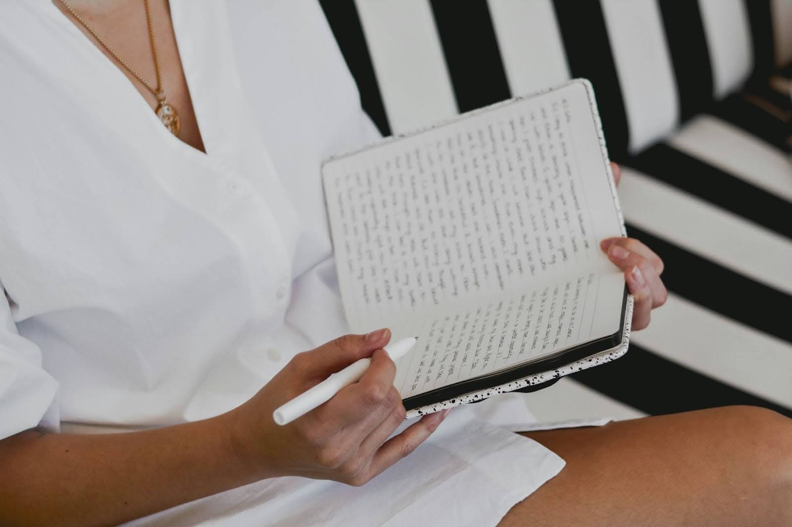 woman writing in journal self love habits